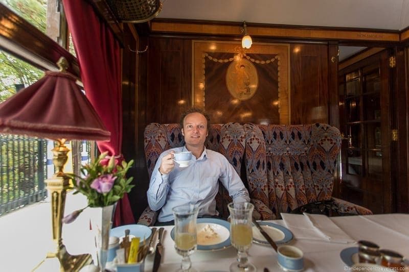 man eating in Ibis British Pullman train