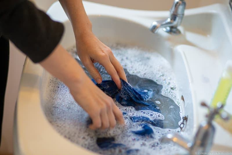 washing clothes in a tub