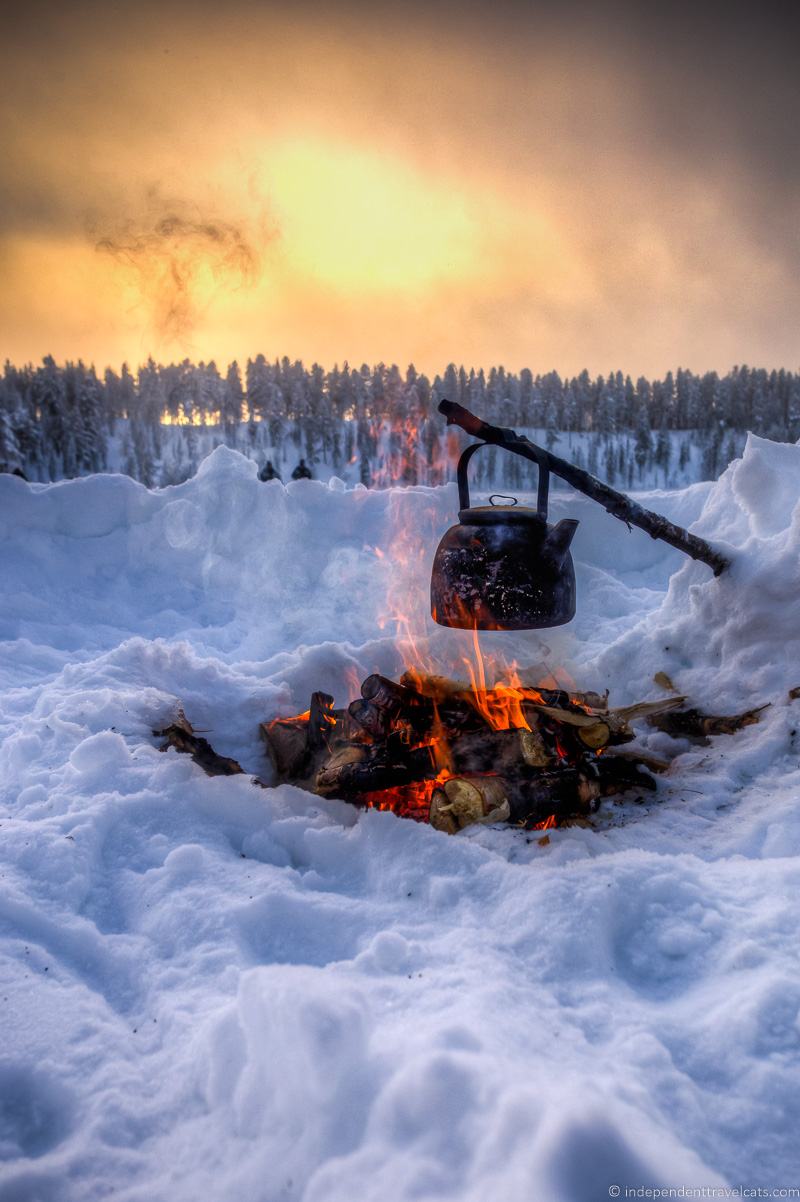 Kettle over campfire Snow winter in Finland winter activities in Finland 