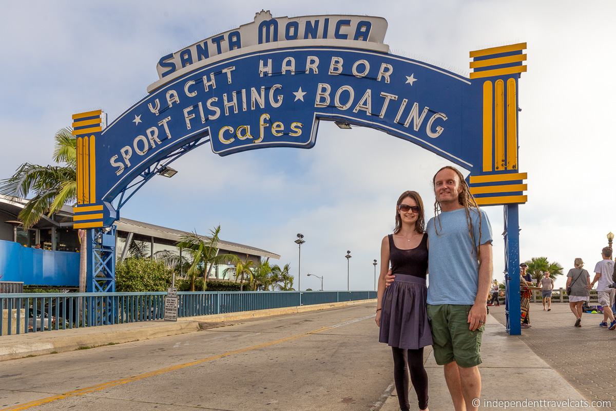 Santa Monica Pier sign California Route 66 travel couple